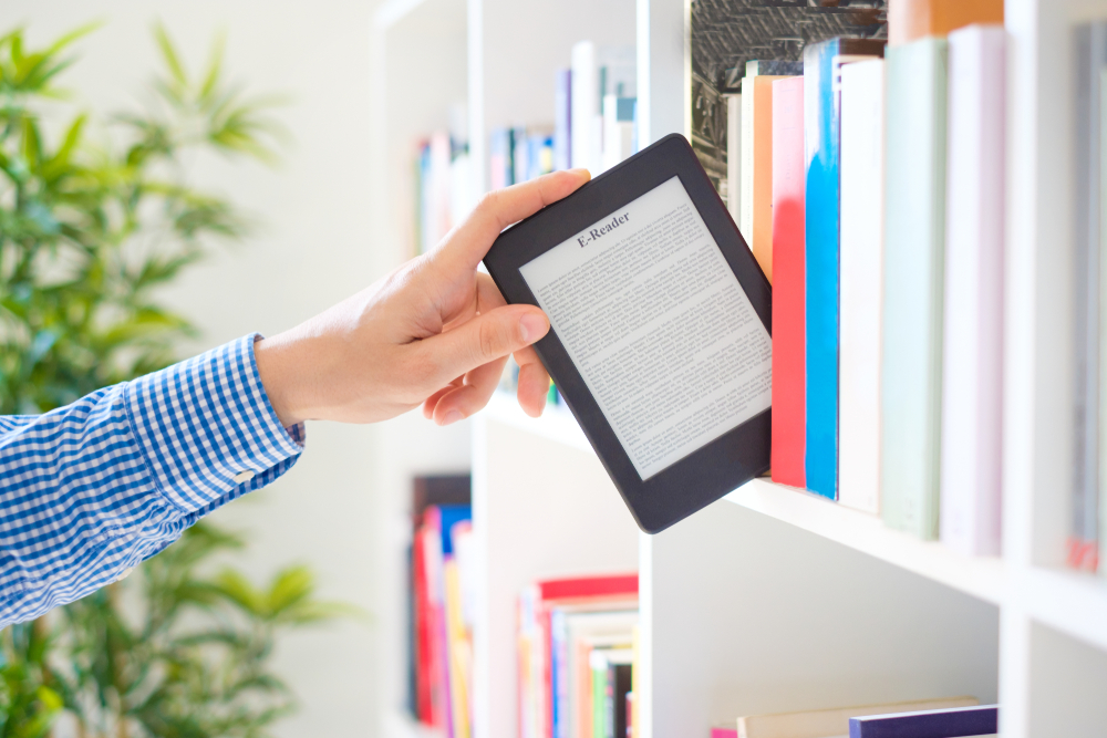 Pros and Cons of eTextbook - image of eTextbook coming off a shelf
